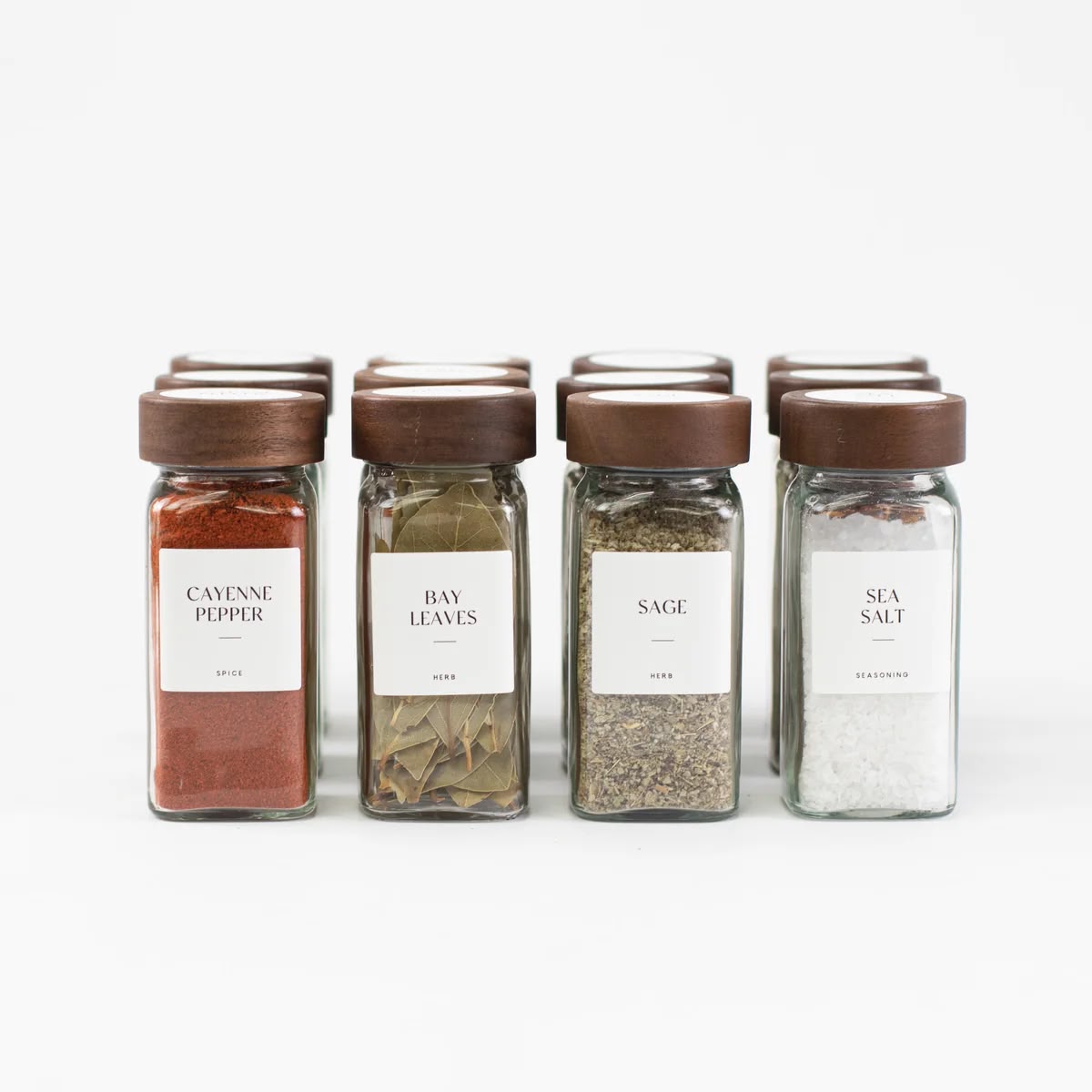 Four spice jars with printed labels